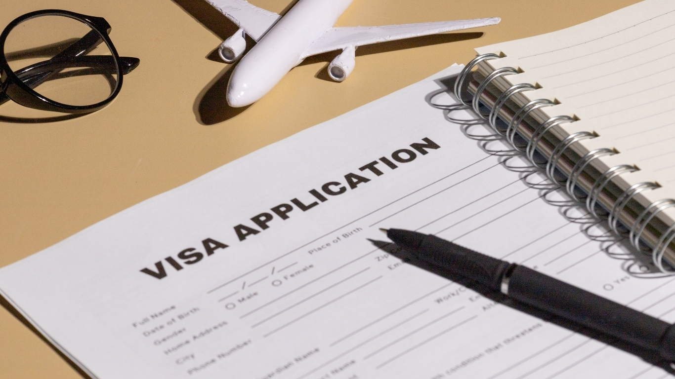 Passport and visa documents on a desk